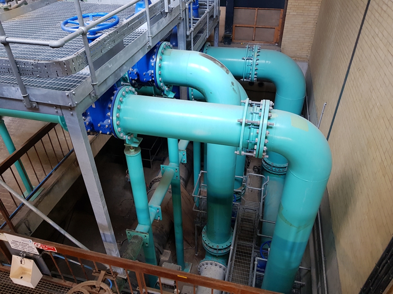 Pipe elbow joints in a valve chamber prior to undergoing reinforcement using Liquid Metal Epoxy Coating