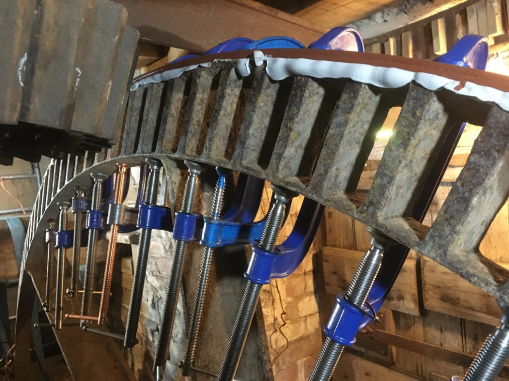 Steel reinforcement hoop attached to a cast iron pit wheel using Sylmasta AB Epoxy Putty during a refurbishment project