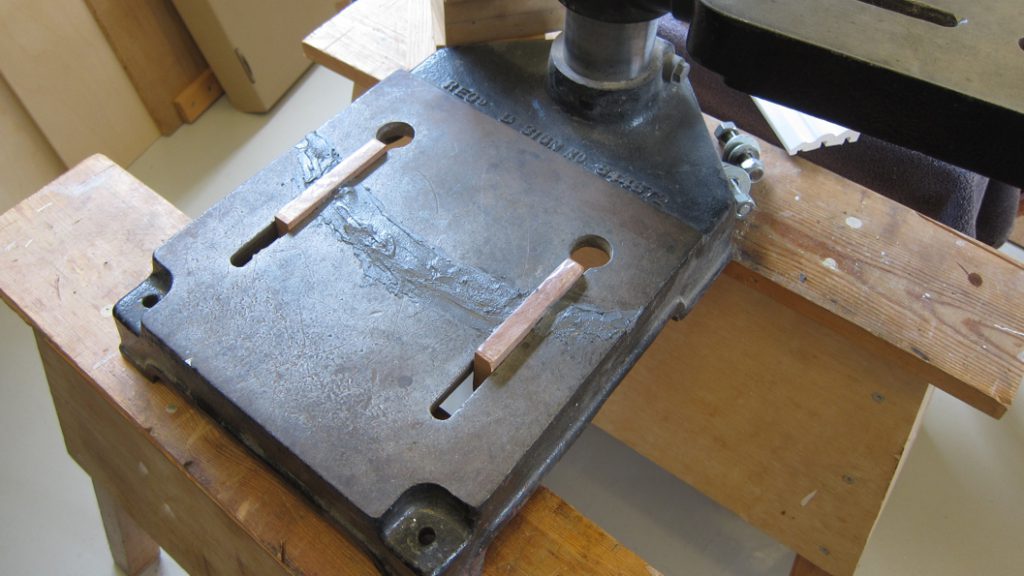 Industrial Metal Epoxy Paste applied to rebuild and refurbish a damaged drill base stand