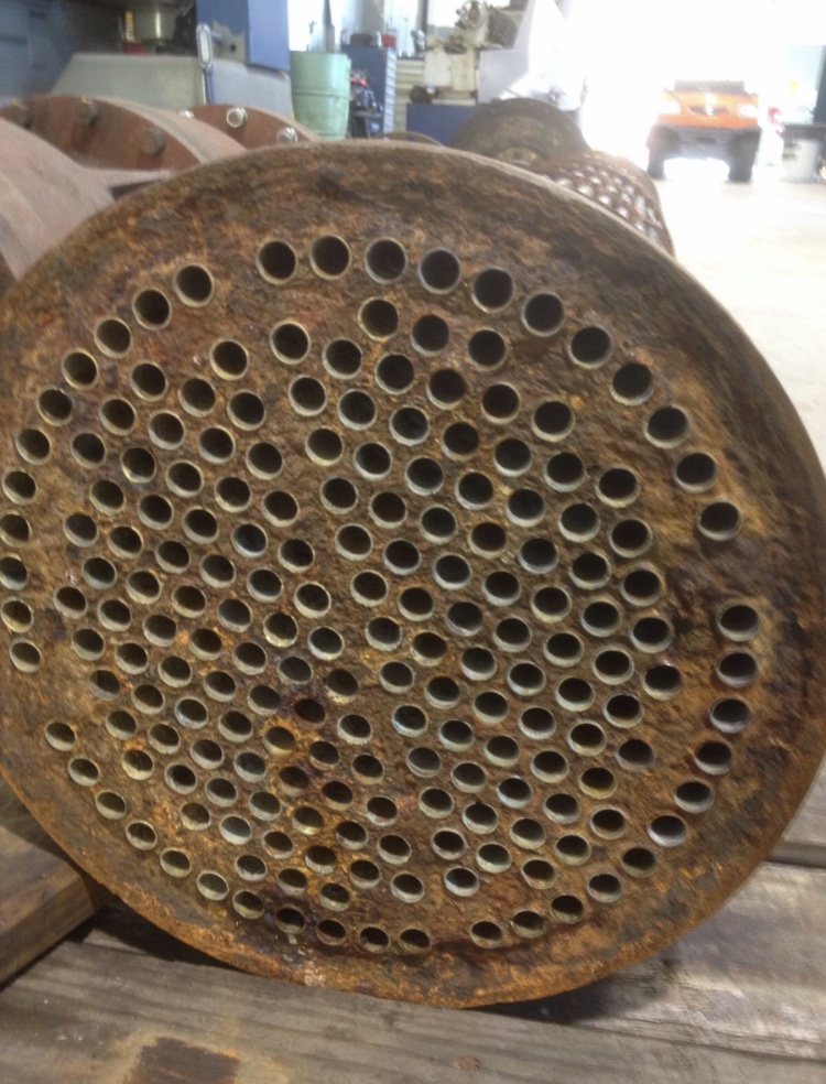 The heavily corroded face of a turbine condenser unit prior to undergoing a rebuild using Sylmasta epoxy paste