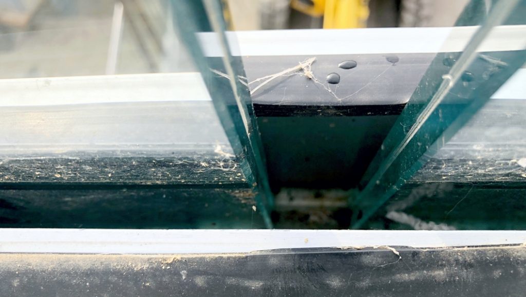 Expansion gap through which water could run onto a balcony below prior to the use of Liquid Rubber as a filler