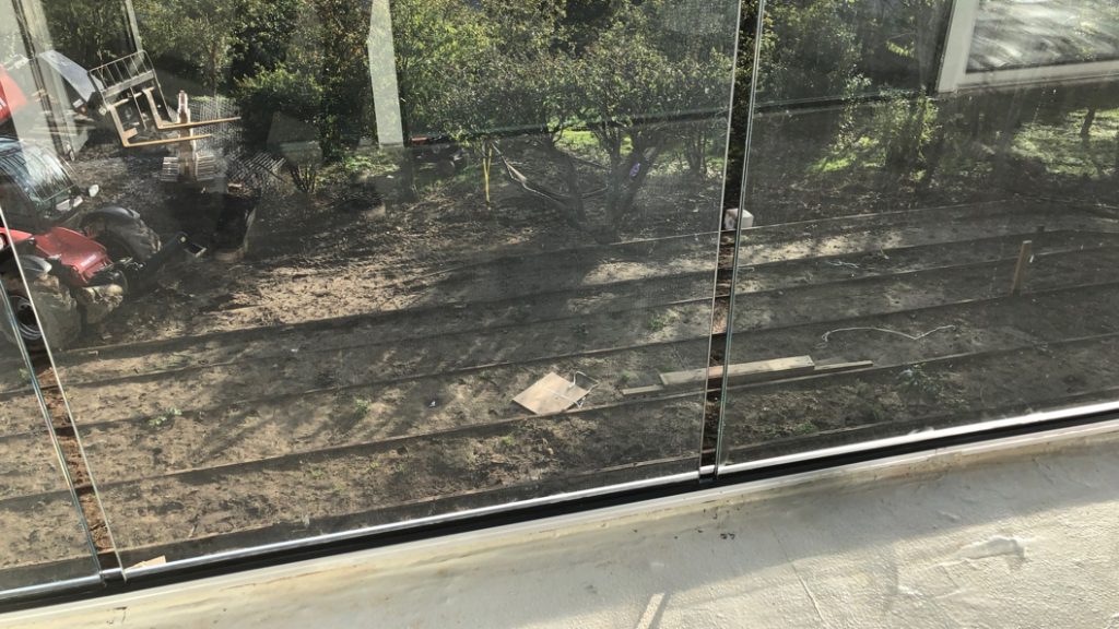 Liquid Rubber used as a filler and poured into expansion gap left for glass panels at a home in the UK