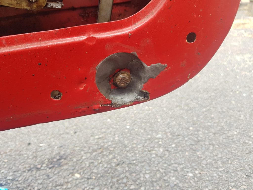 Superfast Steel Epoxy Repair Putty used to fill in rust holes on a classic car door frame