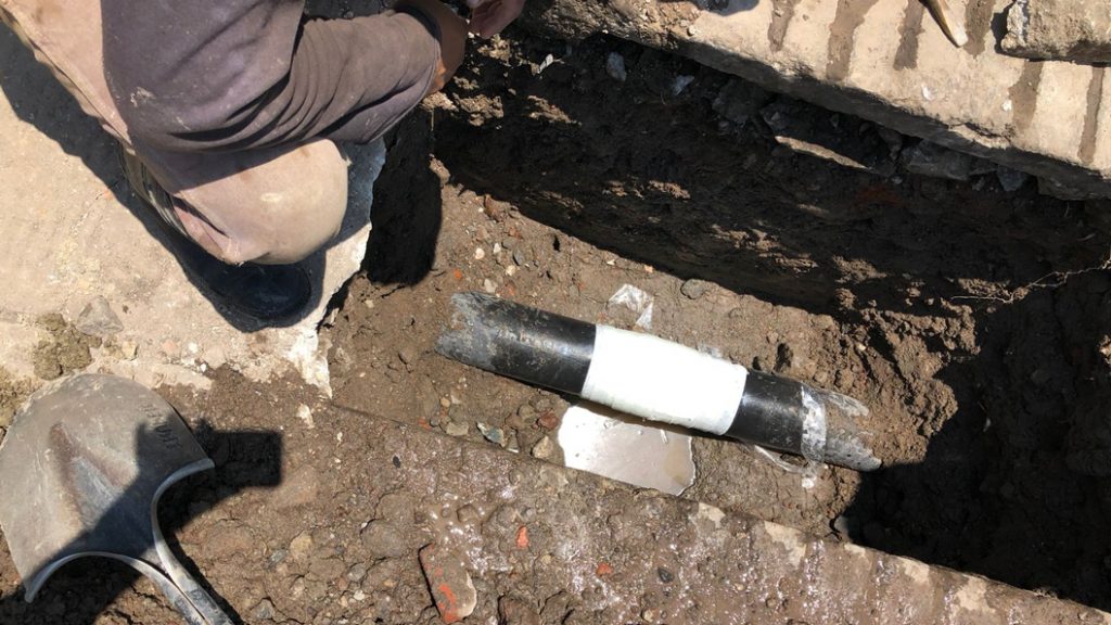 Cemented coated steel pipe live leak repair in Mexico completed with SylWrap HD Pipe Repair Bandage