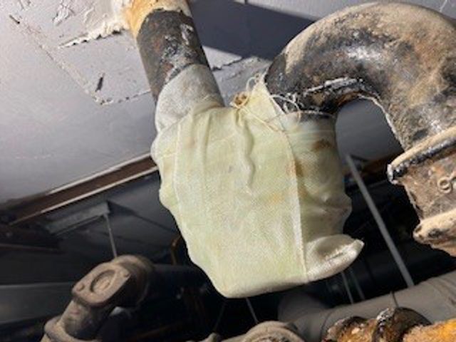 SylWrap HD Pipe Repair Bandage creates a rock hard, impact resistant layer over a hairline crack in a cast iron waste pipe U-Bend