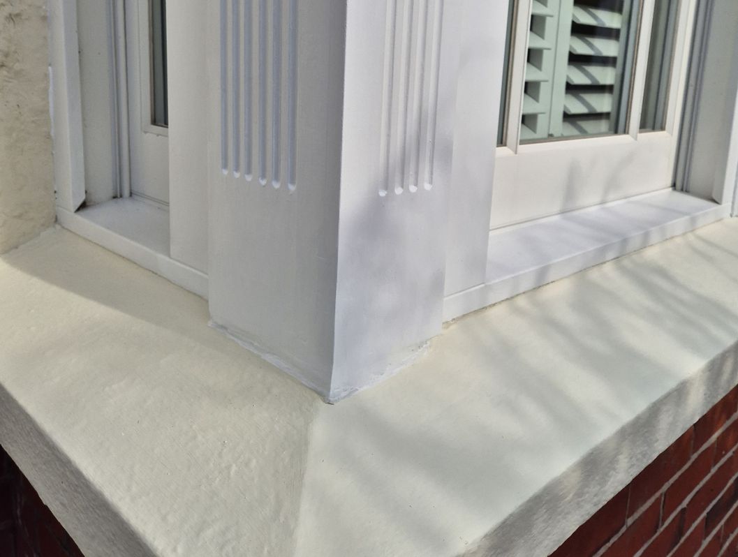 Completed seamless repair of a rooted wood bay sash window frame made using AB Original Epoxy Putty