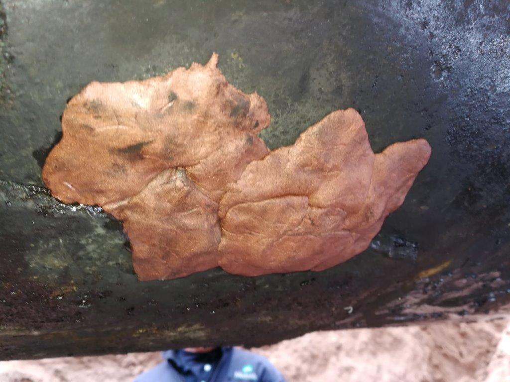 Superfast Copper Epoxy Putty applied to restore the surface profile of a 900mm steel pipe during a repair at an oil well in Argentina
