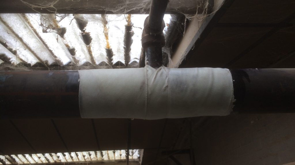 A tee section of a steel pipe in a sprinkler system undergoes repair at a factory operated by a UK furniture company