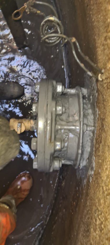 Capped pipe encapsulation in an underground chamber using Liquid Metal Epoxy Coating