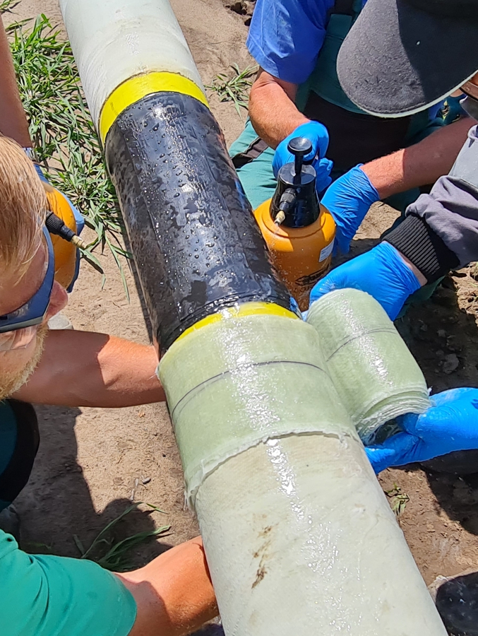 SylShield applied to a welded joint in a natural gas pipe before trenchless installation for protection