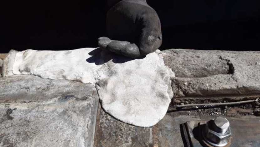 Sylmasta AB Original Epoxy Putty applied to encapsulate a failed clamp as part of an effluent pipe repair