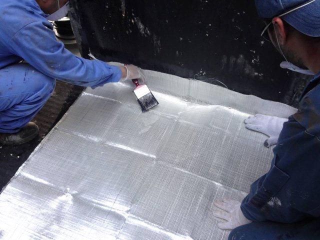 Fibreglass sheeting added as a final layer of repair for