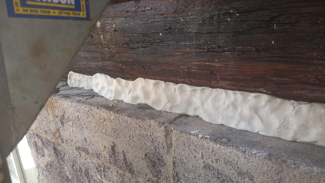 AB Original Epoxy Putty used to repair damage in a rotted wood beam