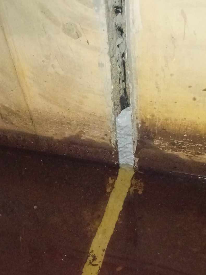 Concrete flood defence wall at a UK dam undergoes repair using Sylmasta AB Original Epoxy Putty after gaps appeared