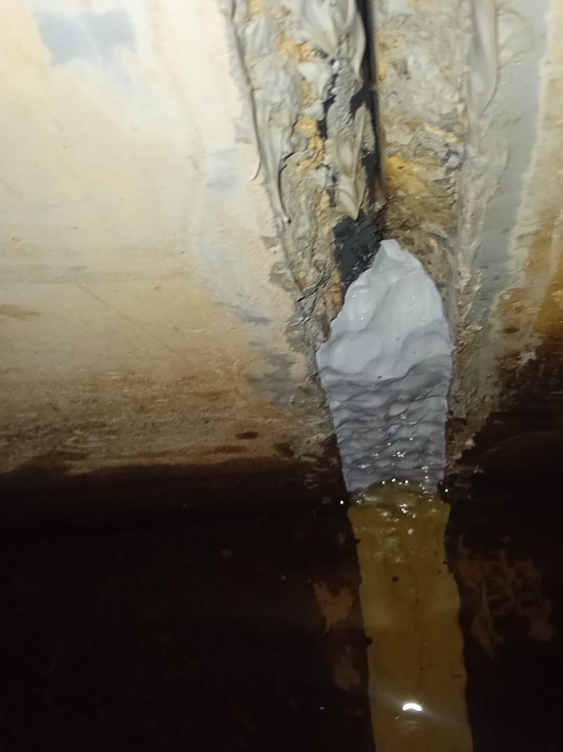 Sylmasta AB Original Epoxy Putty packed into cracks in a flood defence wall, sealing the gaps