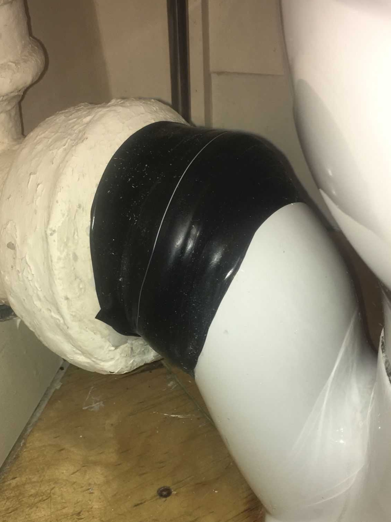 Wrap & Seal Pipe Burst Tape used in the repair of a crack in a porcelain toilet soil pipe