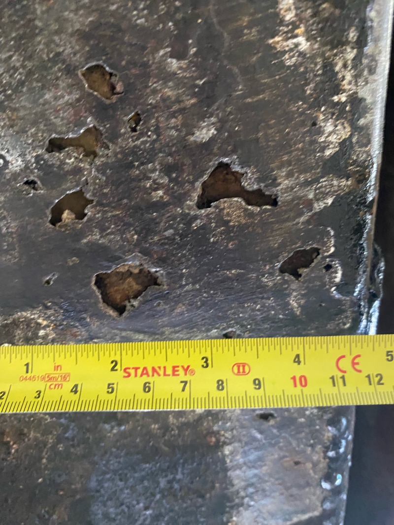 Corrosion had caused holes to appear in the wastewater holding tank of two portable toilet trailers which required repair