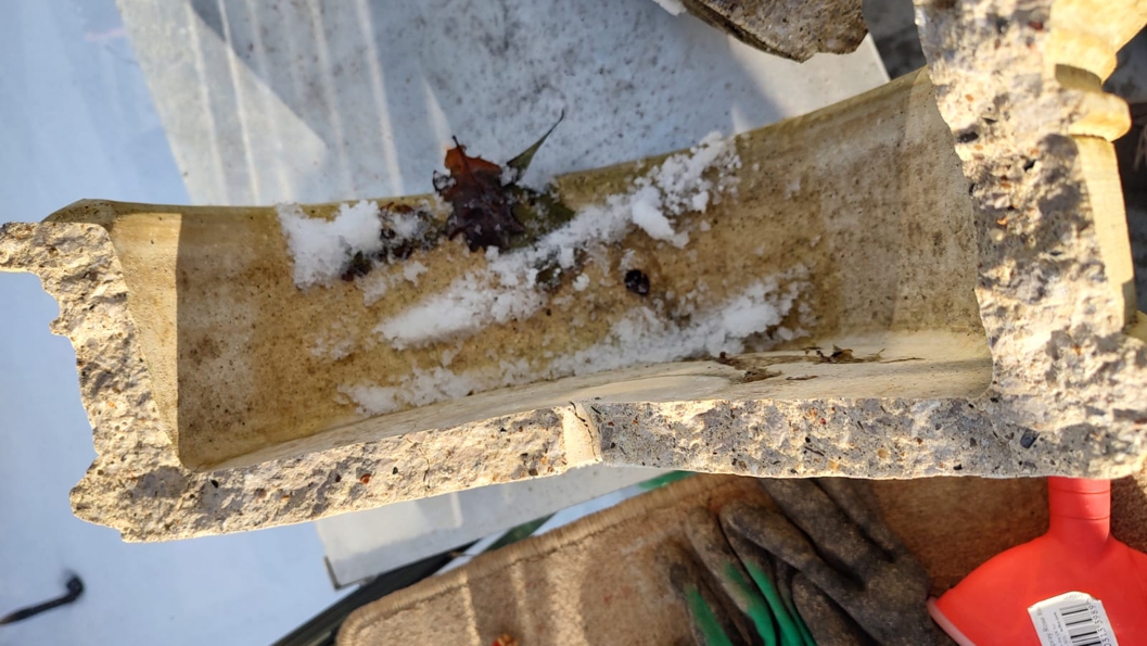 Cracked composite stone water fountain caused by freezing temperatures before undergoing a Sylmasta repair