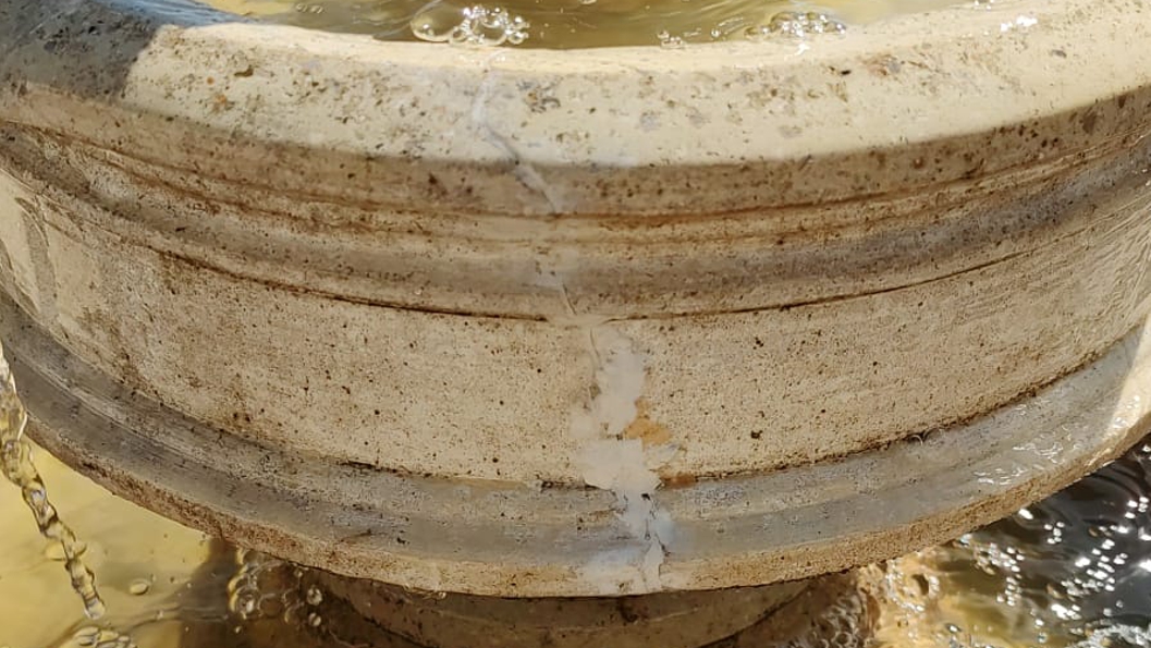 AB Original Epoxy Putty used in the repair of a cracked composite stone water fountain