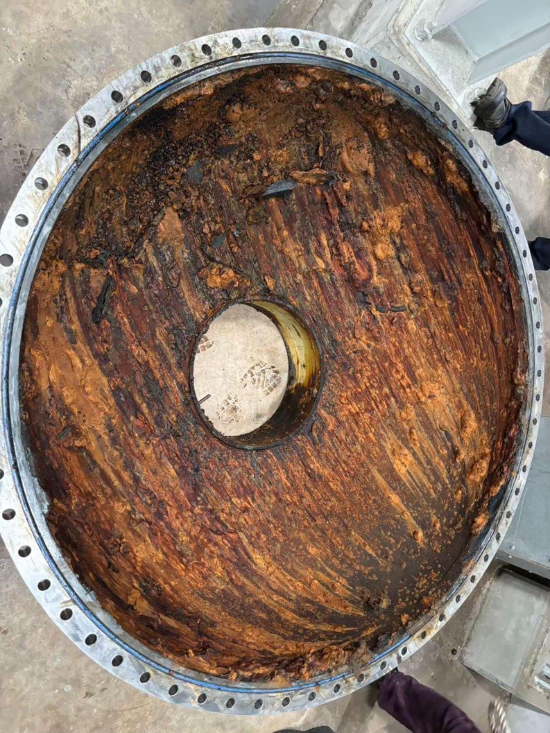 Corrosion to the inside of a heat exchanger water tank without protection from an epoxy coating