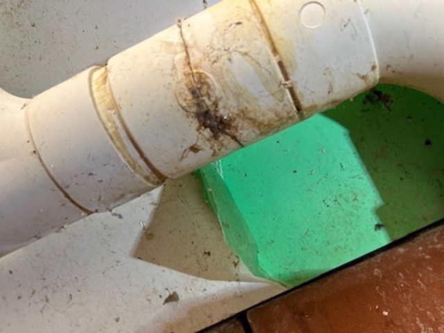 Split in a dishwasher drain pipe before being sealed in under 30 minutes using a SylWrap Universal Pipe Repair Kit