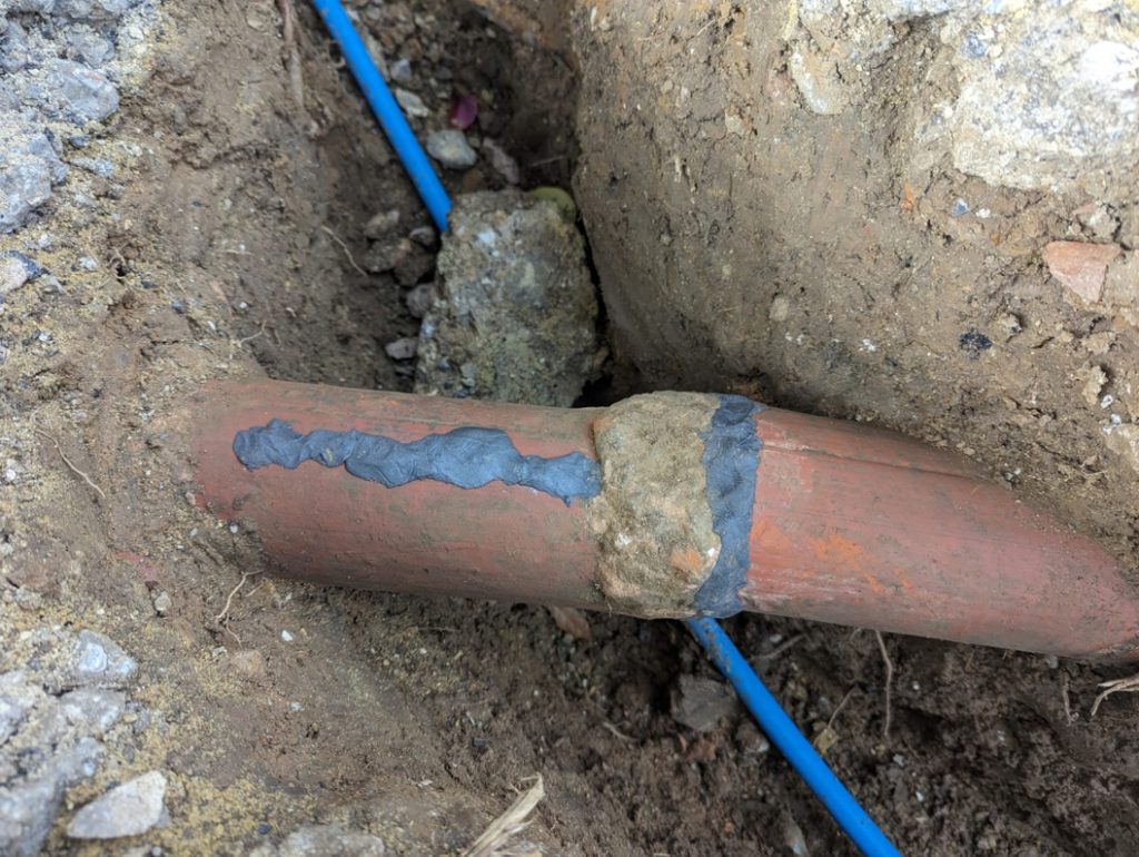 Superfast Steel Epoxy Putty used to repair a cracked underground clay drainage pipe