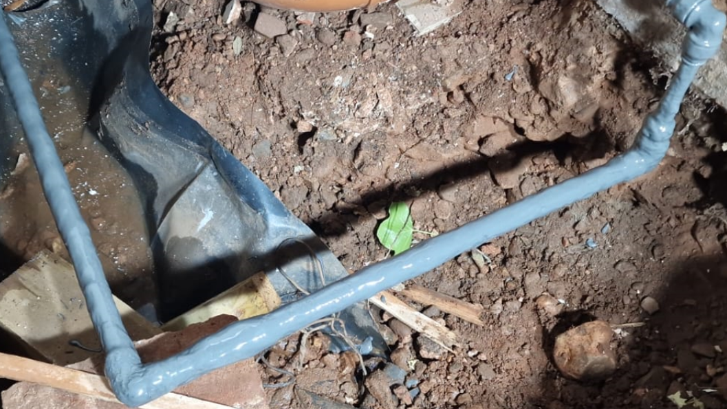 Liquid Metal brush applied to a stone embedded water main supply pipe for repair and protection