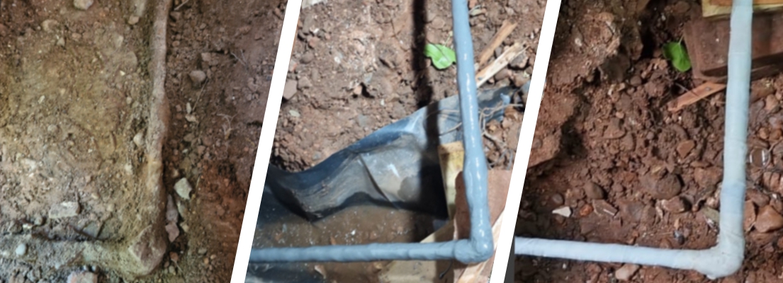 A stone embedded pipe undergoes repair after being discovered leaking underneath a driveway