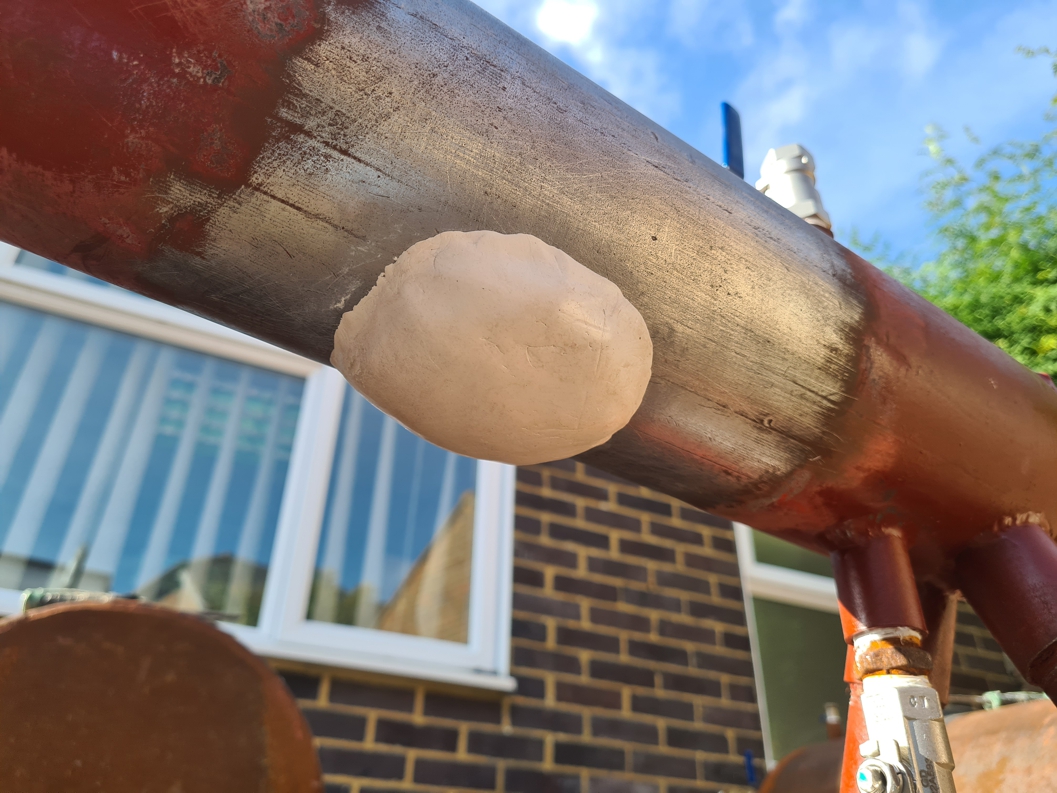 Superfast Aqua PW Epoxy Putty applied to repair a large hole in a leaking carbon steel pipe as part of ASME PCC-2 402-III qualification testing