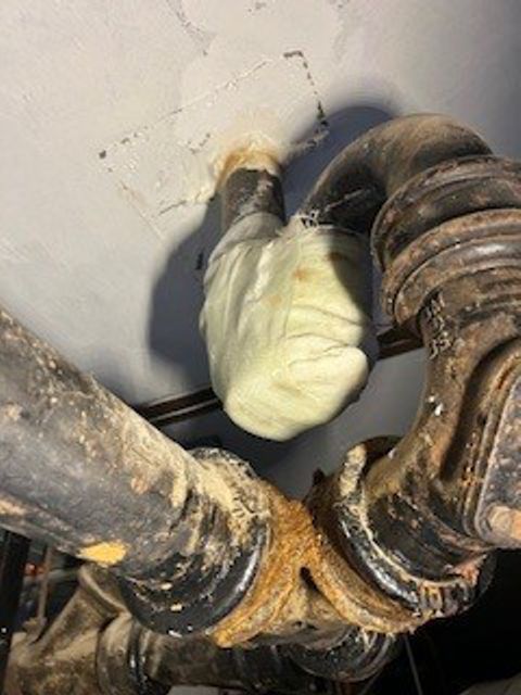 SylWrap HD Pipe Repair Bandage used to repair a leaking cast iron waste pipe U-bend in a hospital