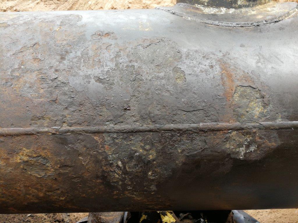 Heavy corrosion to the surface of an oil well 900mm steel pipe prior to undergoing a Sylmasta repair