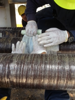 SylWrap HD Pipe Repair Bandage being applied to a contaminated water pipe in a Puerto Rico power station