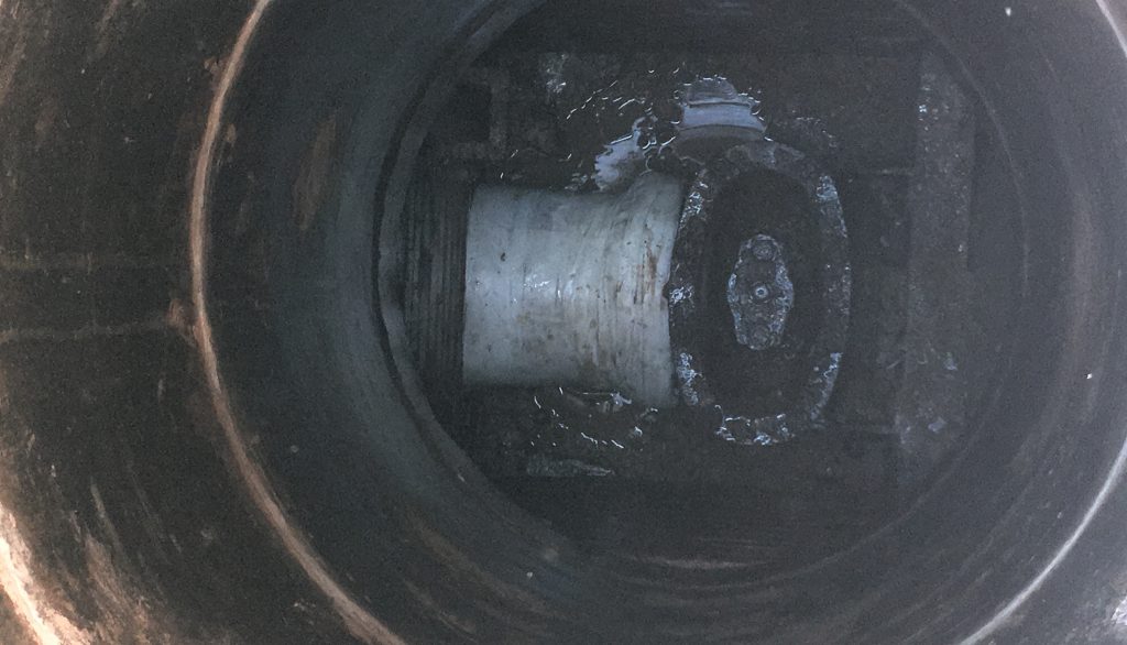 A burst underground carbon steel water undergoes repair by Sylmasta after 15 years of leaking
