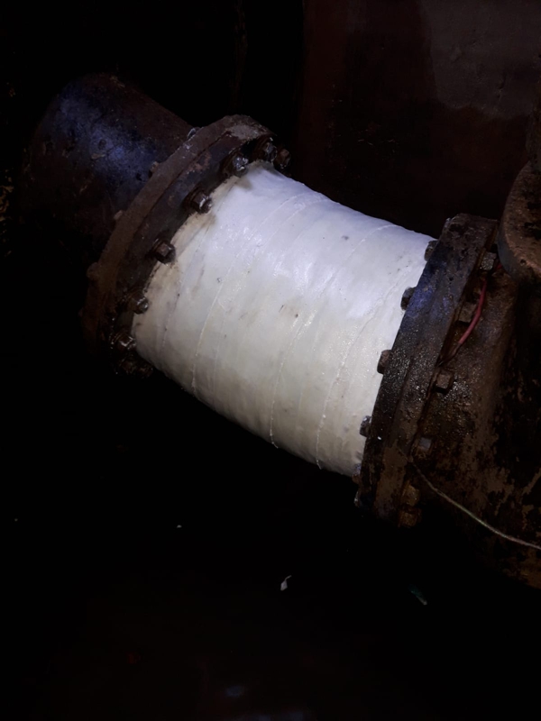 22 degree elbow in a cast iron pipe reinforced using a SylWrap Pipe Repair Bandage