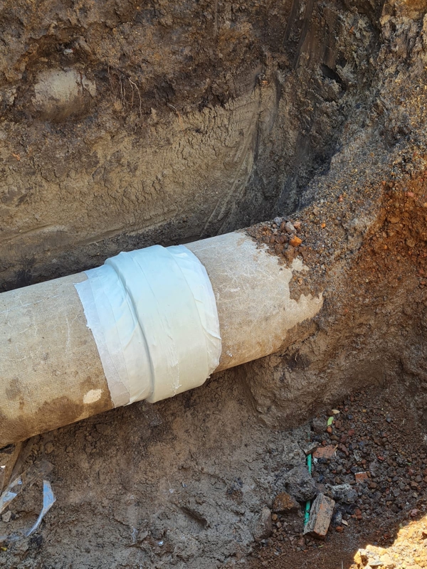 Completed repair of a 600mm asbestos cement pipe leaking from a sleeve