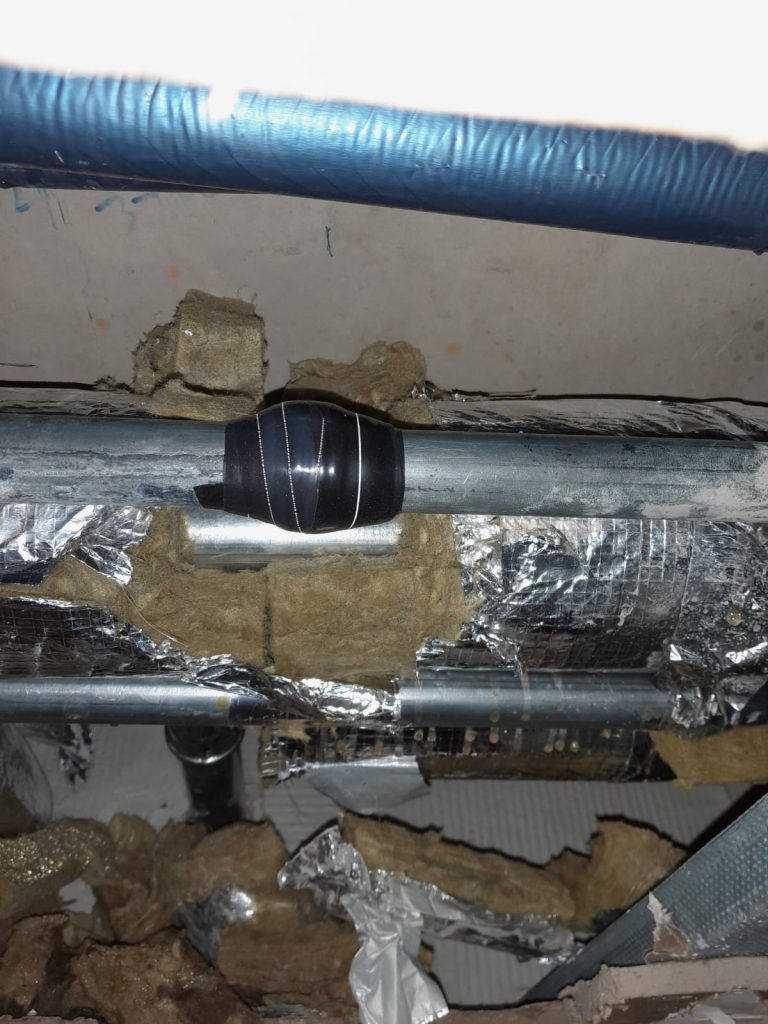 Wrap & Seal Pipe Repair Tape applied to a leaking steel pipe in a district heating system