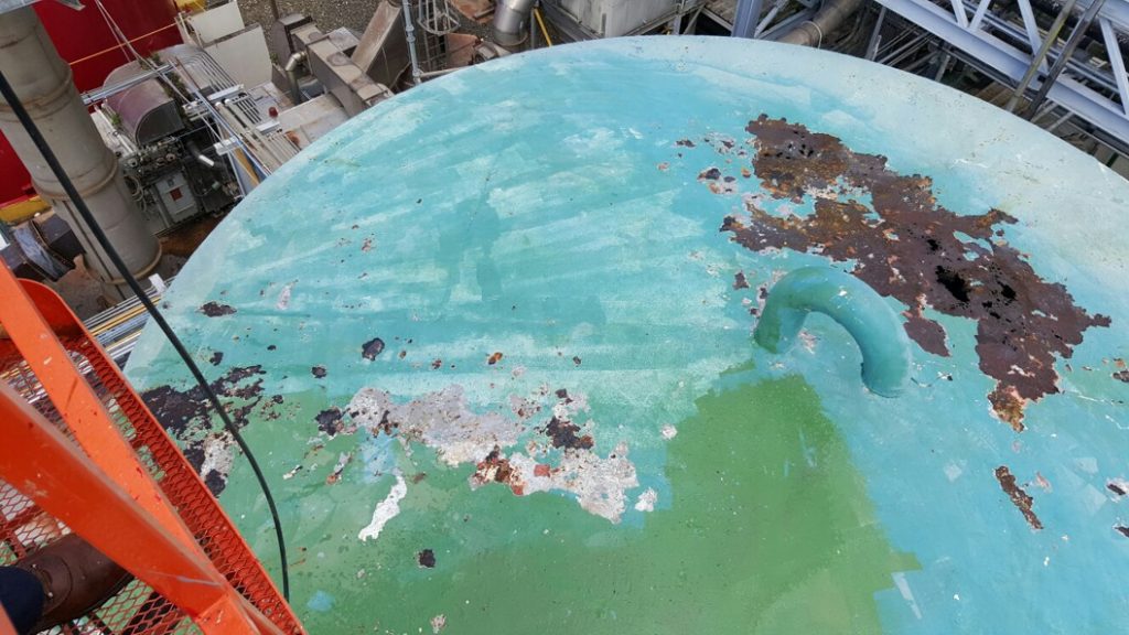 Heavy corrosion to a tank at a pharmaceutical plant prior to undergoing repair