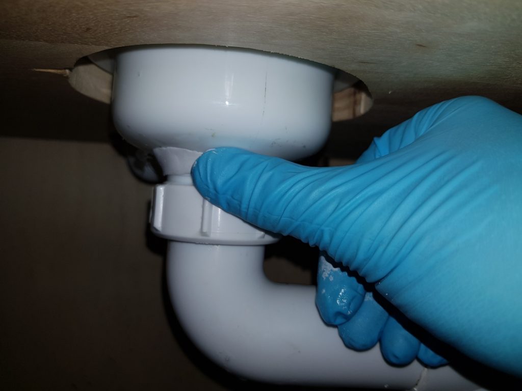 Superfast Plastic applied to leaking PVC bathroom sink drain pipe in a domestic repair