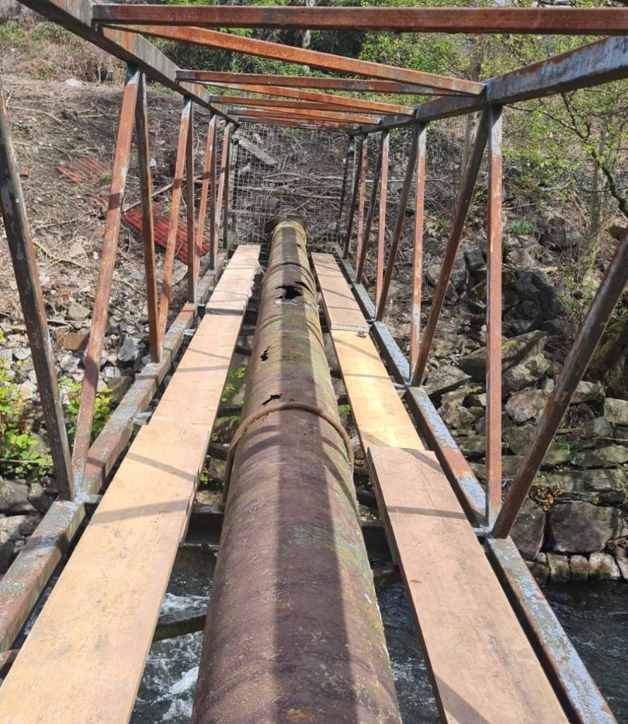 20 metre long steel pipe bridge in South Wales prior to undergoing refurbishment via the Sylmasta Pipe Repair System
