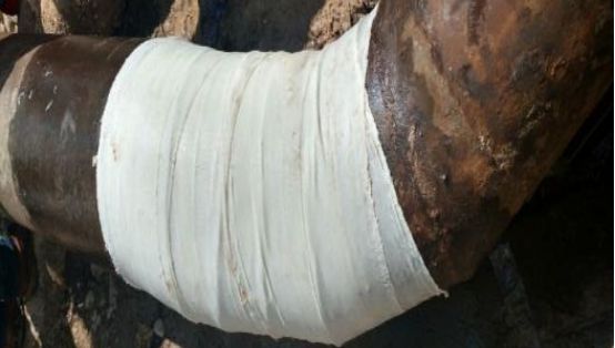 SylWrap HD Pipe Repair Bandage applied to reinforce a steel pipe elbow bend at a wastewater plant in Mexico