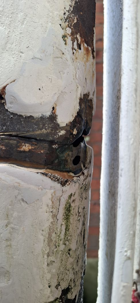Sylmasta AB Original Epoxy Putty is packed into a crack in a soil vent pipe in a DIY repair made by a homeowner