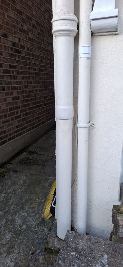 Sylmasta AB Original Epoxy Putty formed into a neat band to imitate a sleeve joint for disguising a crack repair in a soil vent pipe