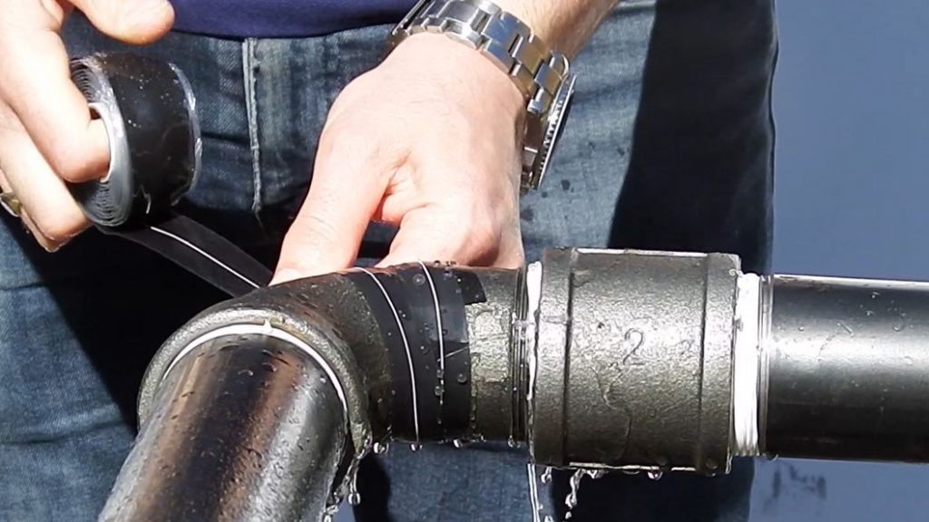 Wrap & Seal Pipe Burst Tape applied to a leaking 90-degree elbow bend to repair a live leak at 3 bar pressure